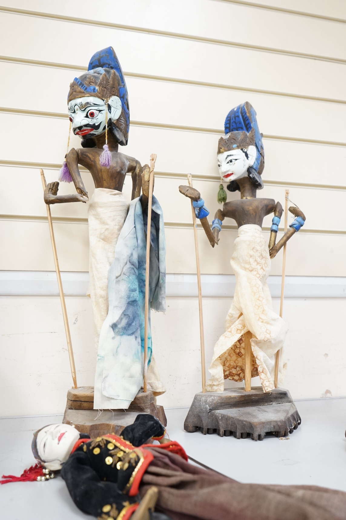 Three Thai carved wooden puppets and similar wooden puppet. Tallest 65cm high. Condition - fair
